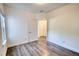 Bright bedroom with a window and gray wood-look flooring, offers a modern and clean aesthetic at 2929 Rambler Dr, Loganville, GA 30052