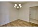 The dining room features wood floors and a modern chandelier at 2929 Rambler Dr, Loganville, GA 30052