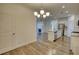 Open concept dining room, kitchen and living area with fireplace at 2929 Rambler Dr, Loganville, GA 30052
