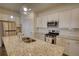 Bright kitchen boasts granite countertops, stainless appliances, and subway tile backsplash at 2929 Rambler Dr, Loganville, GA 30052