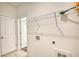 Laundry room with wire shelving and connections in the wall and door at 2929 Rambler Dr, Loganville, GA 30052