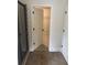Bathroom showcasing tile floors and door to the walk-in closet at 4482 Ridge Mill Ne Ter, Douglasville, GA 30135