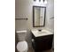 Bathroom with a mirror and toilet at 4482 Ridge Mill Ne Ter, Douglasville, GA 30135