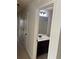 Hallway view of a neutral-walled bathroom with vanity at 4482 Ridge Mill Ne Ter, Douglasville, GA 30135