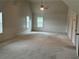 Spacious bonus room features vaulted ceiling, a ceiling fan and several windows providing ample natural light at 4482 Ridge Mill Ne Ter, Douglasville, GA 30135