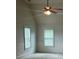 Bonus room features vaulted ceiling, a ceiling fan and two windows providing natural light at 4482 Ridge Mill Ne Ter, Douglasville, GA 30135