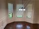 Formal dining area with chair rail molding and many windows for natural light at 4482 Ridge Mill Ne Ter, Douglasville, GA 30135