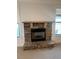 Close-up of a charming stone fireplace with a wooden mantel at 4482 Ridge Mill Ne Ter, Douglasville, GA 30135
