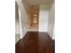 Hallway featuring wood flooring and decorative chair rail at 4482 Ridge Mill Ne Ter, Douglasville, GA 30135