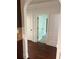 View from kitchen area to hallway with neutral walls and hardwood floors at 4482 Ridge Mill Ne Ter, Douglasville, GA 30135