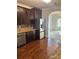 Modern kitchen features stainless steel appliances, dark wood cabinets, and granite countertops at 4482 Ridge Mill Ne Ter, Douglasville, GA 30135