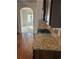 Granite countertops with stainless steel gas range and oven, perfect for culinary enthusiasts at 4482 Ridge Mill Ne Ter, Douglasville, GA 30135