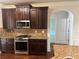 Gourmet kitchen with granite countertops, stainless steel appliances, and hardwood floors at 4482 Ridge Mill Ne Ter, Douglasville, GA 30135