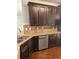 Kitchen showcases stainless steel appliances, granite countertops, and wooden cabinetry at 4482 Ridge Mill Ne Ter, Douglasville, GA 30135