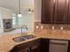 Kitchen area with stone countertops, stainless steel appliances, and view into living area at 4482 Ridge Mill Ne Ter, Douglasville, GA 30135