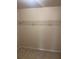 Empty walk-in closet features wire shelving and neutral colored walls and carpet at 4482 Ridge Mill Ne Ter, Douglasville, GA 30135