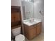 Bathroom with vanity, cabinet storage, white countertop, and a standard toilet at 5425 Village Green Sq, Norcross, GA 30093