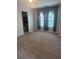Bedroom with carpet, ceiling fan, and curtains. Bathroom through doorway at 5425 Village Green Sq, Norcross, GA 30093