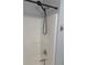 Shower area with white shower walls, silver faucet, and black shower head at 5425 Village Green Sq, Norcross, GA 30093