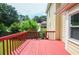 Back deck showing the home's yellow siding, and the backyard at 930 Cedar Bluff Sw Trl, Lilburn, GA 30047