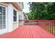 Back deck showcasing the home's exterior and the beautiful backyard at 930 Cedar Bluff Sw Trl, Lilburn, GA 30047