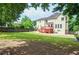 Expansive backyard with lush lawn and mature trees surrounding the property at 930 Cedar Bluff Sw Trl, Lilburn, GA 30047