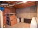Unfinished basement featuring exposed wood ceiling beams and storage space at 930 Cedar Bluff Sw Trl, Lilburn, GA 30047