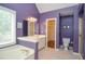 Bathroom features a soaking tub, double vanity, and separate shower at 930 Cedar Bluff Sw Trl, Lilburn, GA 30047