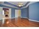 Spacious bedroom featuring hardwood floors and a ceiling fan at 930 Cedar Bluff Sw Trl, Lilburn, GA 30047