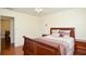 Another bedroom view showcasing hardwood floors, ceiling fan and well-lit space at 930 Cedar Bluff Sw Trl, Lilburn, GA 30047