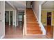 Inviting foyer with hardwood floors and a staircase leading to the upper level at 930 Cedar Bluff Sw Trl, Lilburn, GA 30047