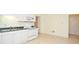 Kitchen features white cabinets, an electric range, and lots of room at 930 Cedar Bluff Sw Trl, Lilburn, GA 30047