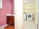 Well-equipped laundry room with washer and dryer hookups at 930 Cedar Bluff Sw Trl, Lilburn, GA 30047