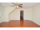 Bright, open living room with hardwood floors and ceiling fan at 930 Cedar Bluff Sw Trl, Lilburn, GA 30047
