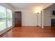 Sunlit living room with wood floors, a fireplace, and neutral paint at 930 Cedar Bluff Sw Trl, Lilburn, GA 30047