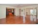 Open living area with hardwood floors that leads to a kitchen at 930 Cedar Bluff Sw Trl, Lilburn, GA 30047