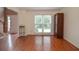 Inviting living room with hardwood floors and a staircase in view at 930 Cedar Bluff Sw Trl, Lilburn, GA 30047