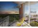 Spacious balcony with seating overlooking the exterior views and tree canopy at 1820 Peachtree St # 1607, Atlanta, GA 30309