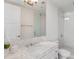 Bathroom featuring marble countertops, white cabinets and a glass enclosed shower at 1820 Peachtree St # 1607, Atlanta, GA 30309
