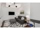 Cozy bedroom featuring a comfortable sofa, sleek lighting, and minimalist decor at 1820 Peachtree St # 1607, Atlanta, GA 30309