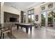 Recreation room featuring a pool table, mounted television, and seating at 1820 Peachtree St # 1607, Atlanta, GA 30309