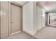 Long, well-lit hallway with neutral carpeting and wall accents at 1820 Peachtree St # 1607, Atlanta, GA 30309