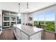 Bright kitchen with an island, stainless steel appliances, and a stunning view of the landscape at 1820 Peachtree St # 1607, Atlanta, GA 30309