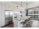 Modern kitchen boasts a large island, stainless steel appliances, and balcony access at 1820 Peachtree St # 1607, Atlanta, GA 30309