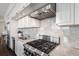 Chef's kitchen featuring high-end appliances, granite countertops, and ample cabinet space at 1820 Peachtree St # 1607, Atlanta, GA 30309