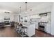 Bright open kitchen featuring stainless steel appliances, a large island with bar seating, and hardwood floors at 1820 Peachtree St # 1607, Atlanta, GA 30309