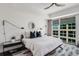 The main bedroom features a king size bed, a ceiling fan, and large windows with exterior views at 1820 Peachtree St # 1607, Atlanta, GA 30309