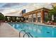 Outdoor pool area with brick building and lounge chairs, perfect for relaxing and enjoying the sun at 1820 Peachtree St # 1607, Atlanta, GA 30309