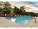 Inviting outdoor pool surrounded by lush greenery and lounge chairs offering a serene recreational space at 1820 Peachtree St # 1607, Atlanta, GA 30309