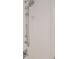 Shower with white tiled walls, chrome fixtures and a built in seat at 1820 Peachtree St # 1607, Atlanta, GA 30309